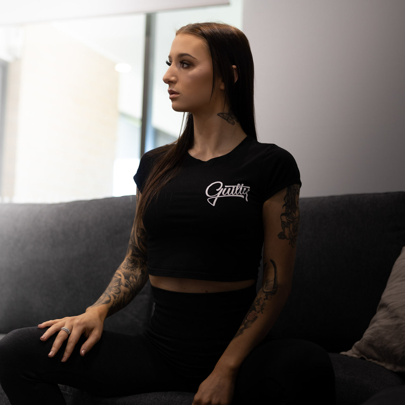 Guilty Crop Tee Black - Women's black crop tee by Guilty Apparel, perfect for action sports and adventure