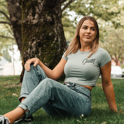 Guilty Apparel Crop Tee Grey - Casual and comfortable grey crop top with a black Guilty Apparel logo printed on it.
