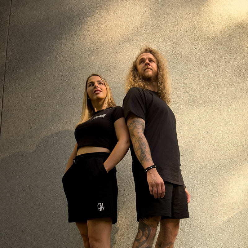 Unisex GA Shorts - Black athletic shorts by Guilty Apparel featuring GA logo, perfect for action sports and adventure