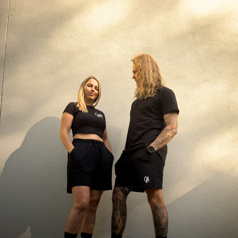 Unisex GA Shorts - Black athletic shorts by Guilty Apparel featuring GA logo, perfect for action sports and adventure