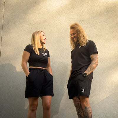 Unisex GA Shorts - Black athletic shorts by Guilty Apparel featuring GA logo, perfect for action sports and adventure