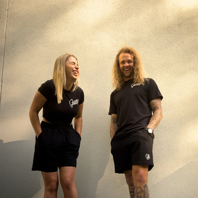 Unisex GA Shorts - Black athletic shorts by Guilty Apparel featuring GA logo, perfect for action sports and adventure