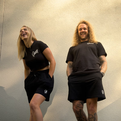 Unisex GA Shorts - Black athletic shorts by Guilty Apparel featuring GA logo, perfect for action sports and adventure