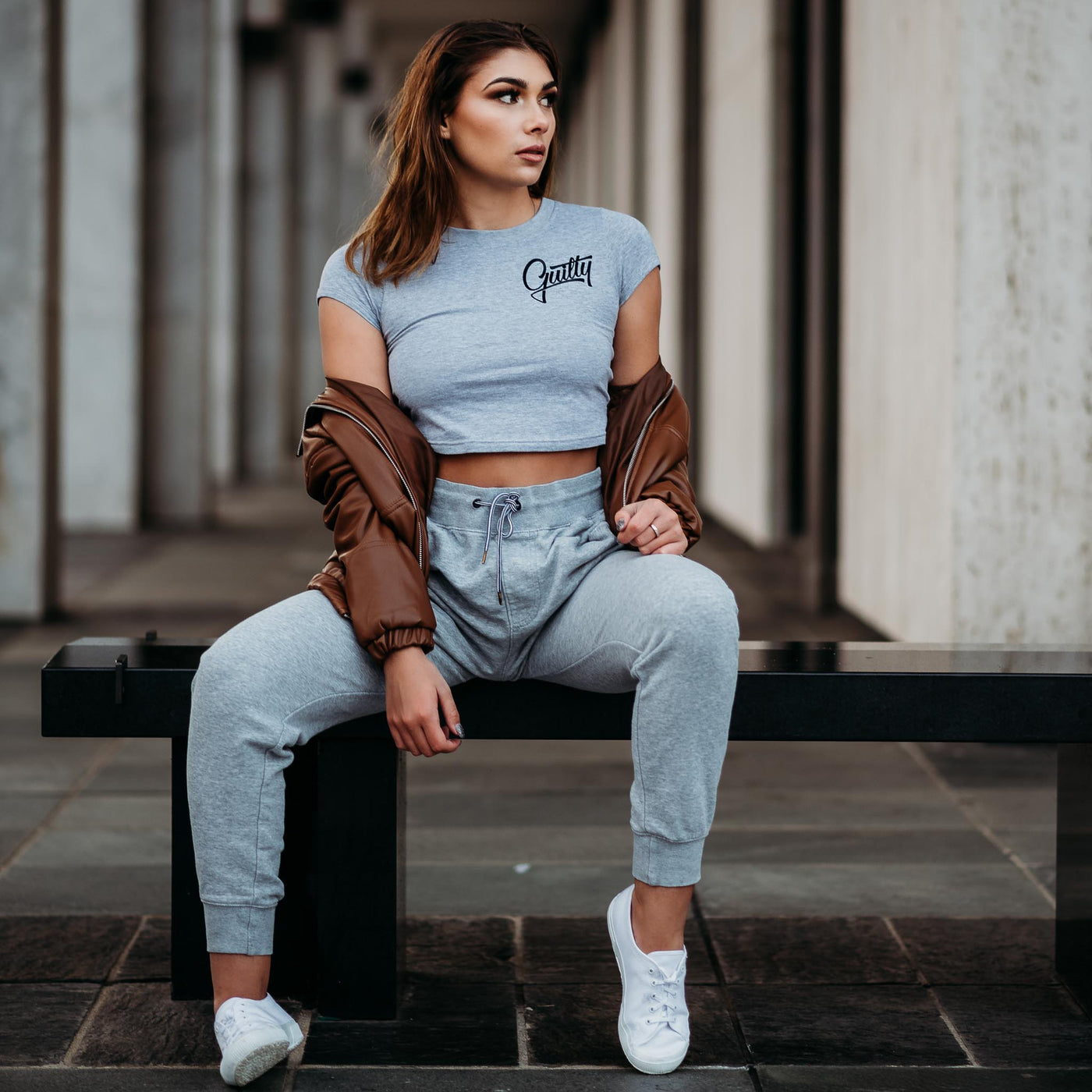Guilty Apparel Crop Tee Grey - Casual and comfortable grey crop top with a black Guilty Apparel logo printed on it.