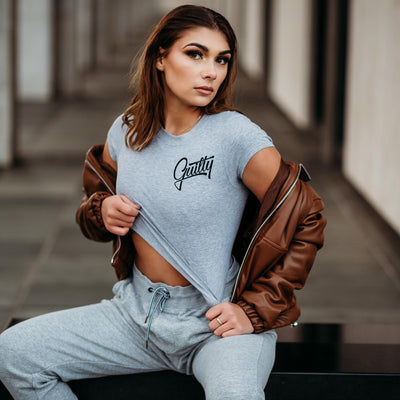 Guilty Apparel Crop Tee Grey - Casual and comfortable grey crop top with a black Guilty Apparel logo printed on it.